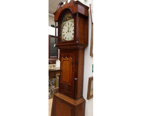 An early 19th century oak and mahogany eight day longcase clock, with a white enamelled dial with black Roman numerals and a 