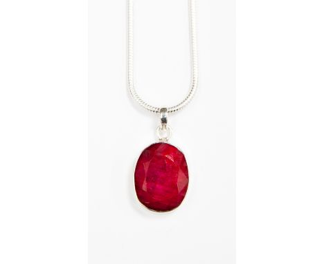 A Ruby pendant necklace, the multi-faceted dyed natural stone of approximately 10ct, set in a silver mount and fitted on a si