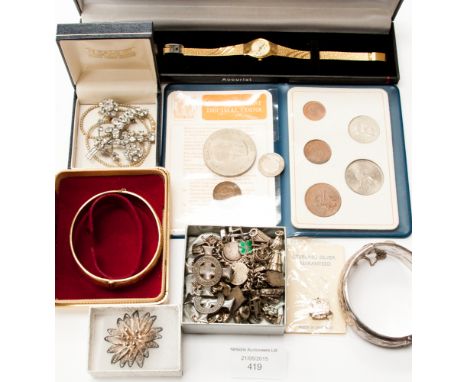 An Assortment of vintage jewellery to include a charm bracelet, various silver charms, boxed bracelets, Accurist watch, etc (