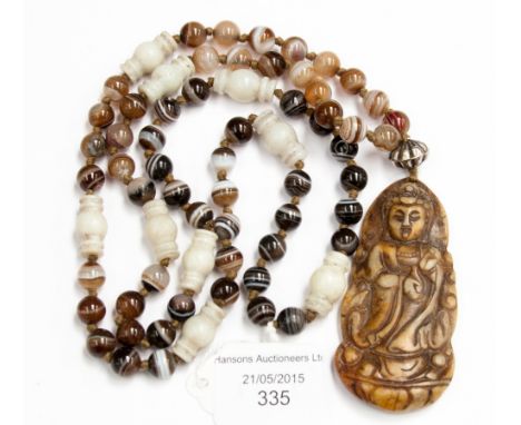 A jade pendant with interspaced banded agate beads