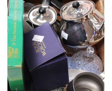 A box containing a four piece stainless steel tea and coffee service, a Wedgwood plate, Royal Worcester pin dishes, glass bow