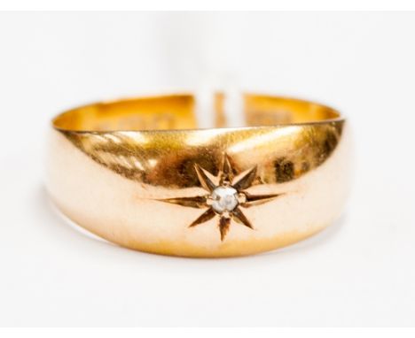 An 18ct and central diamond ring 