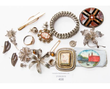 A Scottish Victorian agate brooch, a silver gilt filigree and mother of pearl brooch, a painted brooch front of the Fort of D