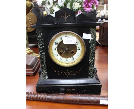 A black marble mantel clock, with Arabic numerals, together with a truncheon