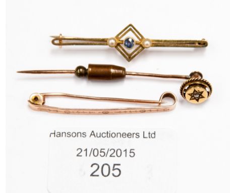 A 9ct gold tie pin, a yellow metal stick pin and another yellow metal tie pin (3) 