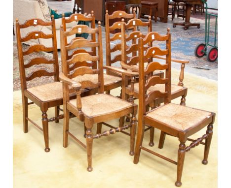 A set of six oak ladder back chairs, comprising to carver chairs and four side chairs,m all with rush seats (6) 