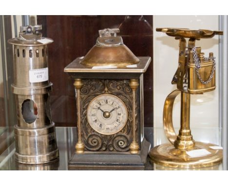 Three cigarette lighters - ornamental casings, including mantle clock, miners lamp and Mansfield Ale ash tray 