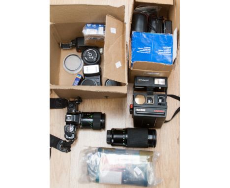 A Minolta X500 SLR 35 mm camera, with two lenses, two flash units, filters and film, and further small cameras 
