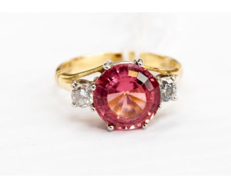 An 18ct gold, pink tourmaline and diamond three-stone ring, ring size O