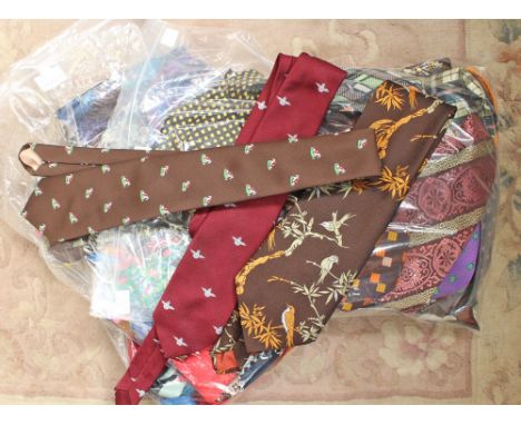 Two bags containing a large collection of assorted printed and woven ties, including 22 woven polyester ties, in various colo