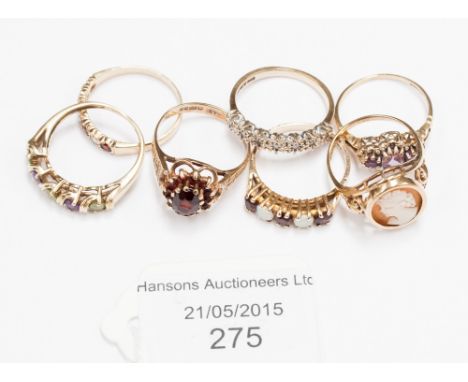 A 9ct cameo ring, opal and garnet ring and five other rings 