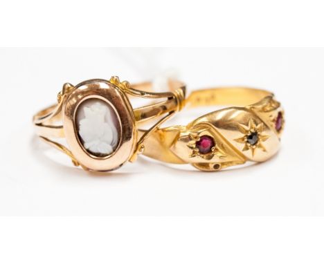 An 18ct gold gypsy set ruby and diamond ring and a 15ct cameo ring 