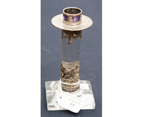 A white metal, purple enamel and glass candlestick, circular drip pan above Neo-Classical style swags similar ribbon and corn