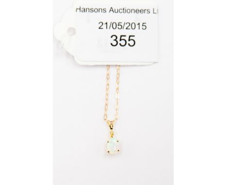 An opal and diamond pendant and chain