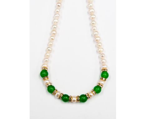 A Freshwater Pearl and Jade single strand necklace, the centre of the necklace with alternated jade beads and freshwater pear