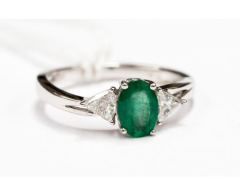 An 18ct emerald and diamond ring
