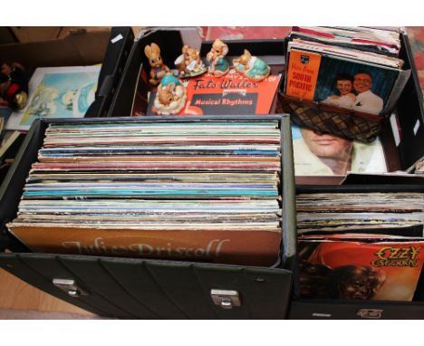 A record LP box including pop and rock. One 7" record box. Two boxes with records and memorabilia and amazing robot game