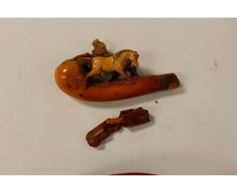 A late 19th Century meerschaum with horse and hunting dogs, amber mouthpiece damaged 