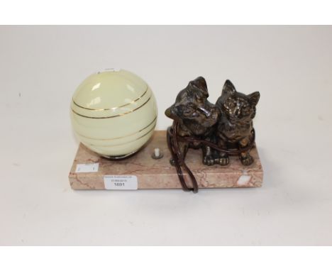 An Art Deco lamp, decorated with a cat and dog