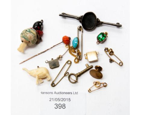 A small collection of brooches, a black baby pendant, coral and gold stick pin, etc, parcel lot 