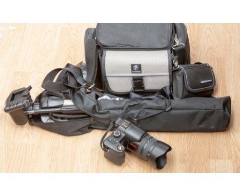 A modern Panasonic Lumix digital camera, with leads, tripod and carry bags (2) 