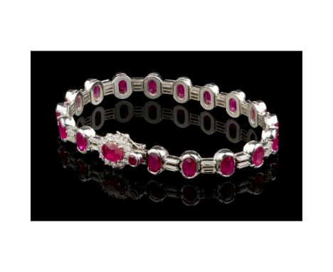 A braceletGold 750/000Set with 1 round cut ruby, 18 oval cut totalling approximately 6,80 ct., 34 baguette cut diamonds total