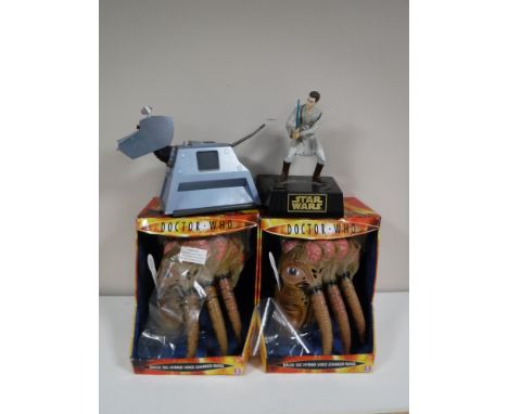 Two boxed Doctor Who voice changing masks together with a Doctor Who K-9 and a Star Wars Obi Wan Kenobi figure
