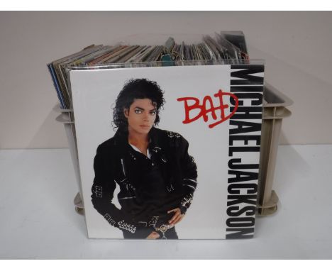 A box and a case containing LP's, including 80's, Wet Wet Wet, Michael Jackson, The Beatles, etc 