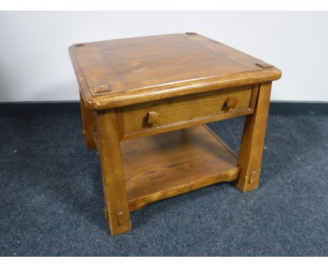 A contemporary two-tier lamp table fitted a drawer