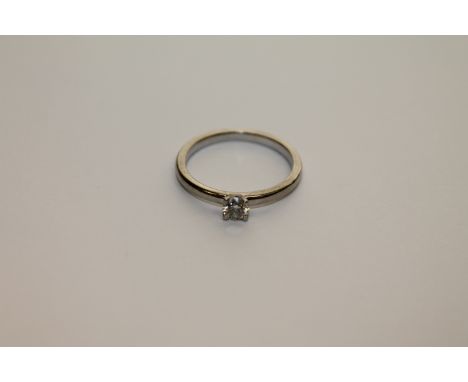 A platinum diamond solitaire ring, size M