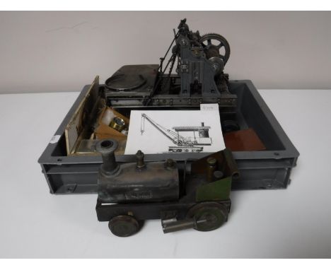 A box containing a live steam engine and assorted components including a Stuart gauge