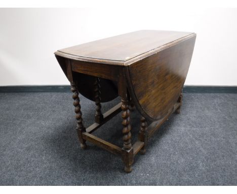 An oak barley twist gate leg table 