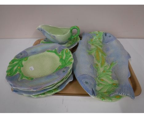 A Melba ware salmon serving plate, together with six dinner plates, and a gravy boat on stand (9) 