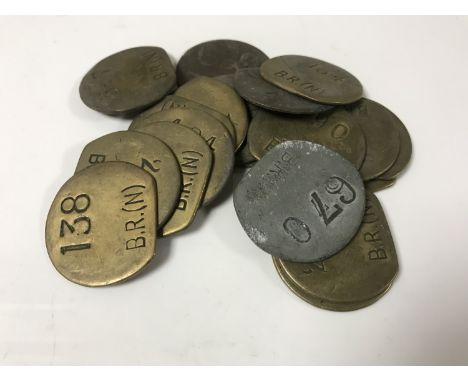 Nineteen vintage brass railway pay check tokens. (19)