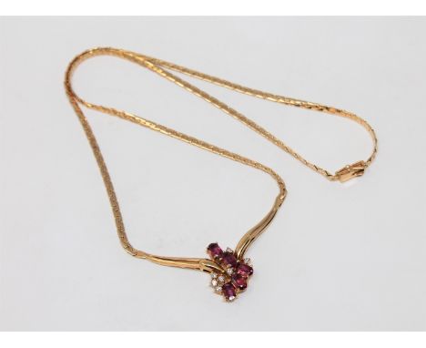 A fine quality 18ct gold ruby and diamond necklace, 12.4g.