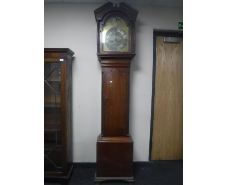 A George III oak longcase clock with brass moonphase dial