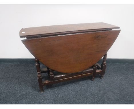 A Victorian oak gate leg table 