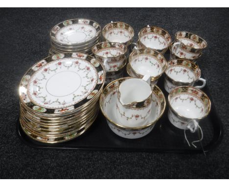 A tray of thirty pieces of antique Melba tea china 
