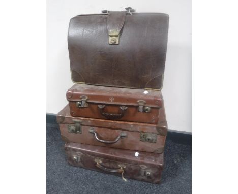 Three vintage luggage cases and a briefcase 