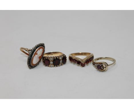 A ruby and diamond set ring, a garnet wishbone ring, cameo ring etc (4) CONDITION REPORT: 16.7g