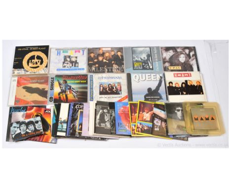 Rock CD Singles comprising of artists such as Magnum, Genesis, U2, Gary Moore and others to include Roger Waters, The Tide is