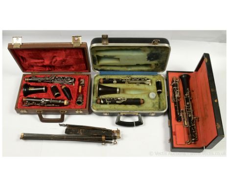 Vintage Clarinets/Oboes in carry cases plus vintage music stand. Not checked for completeness but only appear Fair to Good. (