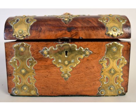 A burr walnut and brass mounted tea caddy with domed lid centred by a pharoah's mask with an interior of two lidded compartme