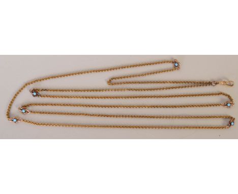 A Victorian gold and turquoise mounted ladies long chain, the pendant loop marked S.P, 140cmL, gross weight 0.77oz