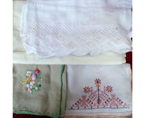 A large lot of vintage table and bed linens. To include damask tablecloths and a white cotton blouse. (Qty)