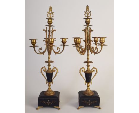 A Louis XIV style late 19th century pair of black slate and metal candlestick holders each with four cups of gilt foliate des