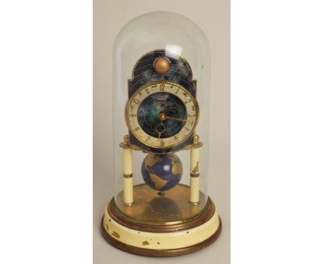 A German brass `400 day` anniversary timepiece, circa 1950 by Kaiser Clock Company, the celestial blue dial depicting the pla