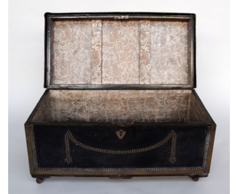 A late 17th century travel trunk bearing brass label 'Captain Pyne' to top, covered in leather with studwork, metal banding a
