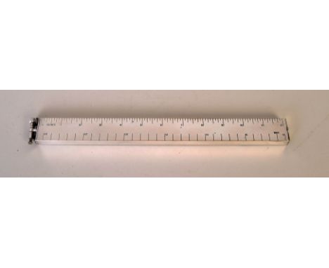 A Dunhill desk lighter in the shape of a combination unit ruler stamped 'Rotol and British Messier' on the reverse, 30cmL
