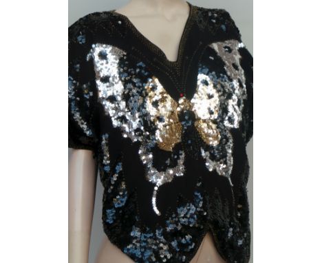 An L A Golo possibly 1980s sequinned fitted dress with very low back detail and slit to back seam - size 8-10. A vintage sequ